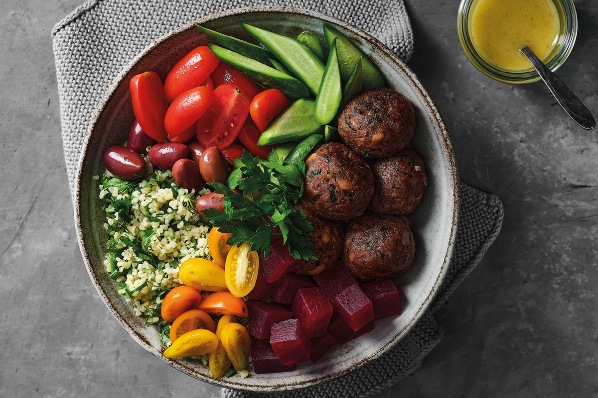 Redefine mince balls with tabbouleh and fresh vegetables